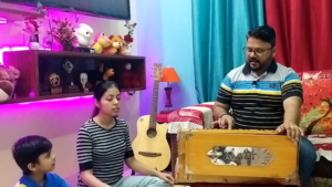 Vocalist taking class on harmonium