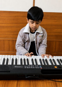 Kid playing piano